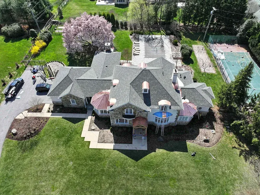 Asphalt shingles installation on a large residential estate in Maryland.