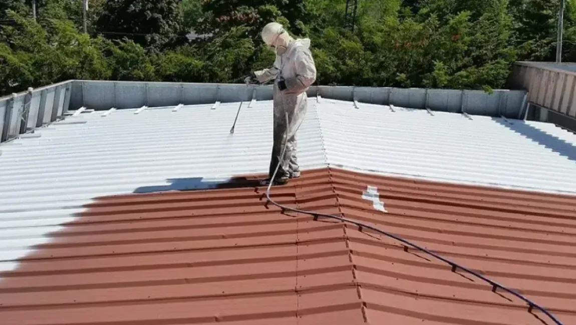 Roof coating applied to a low-slope roof system