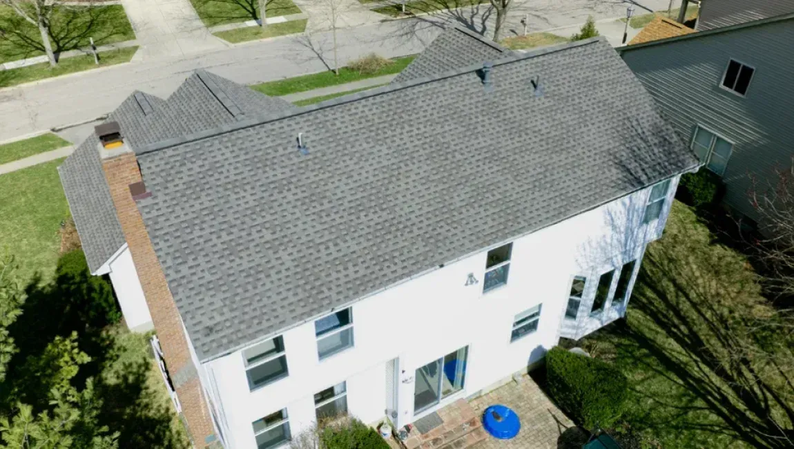 Asphalt shingle roofing on a white residential home in Rockville, Maryland.