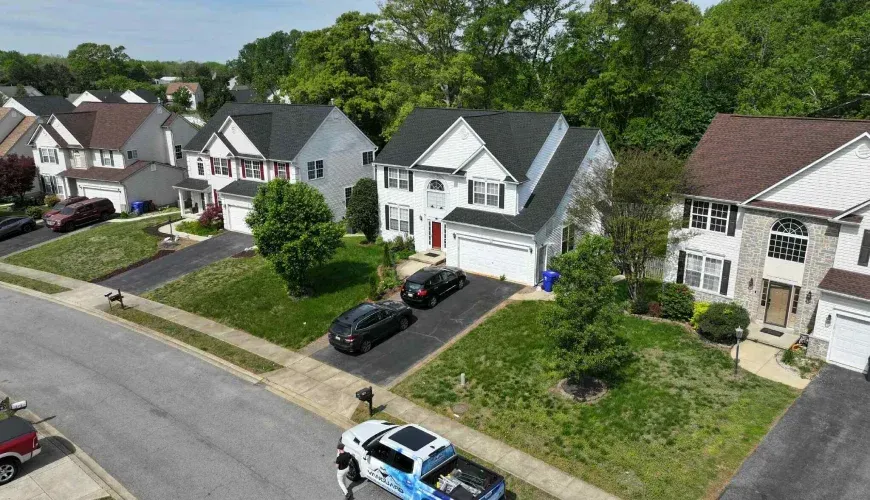 Asphalt shingle roof installations on residential homes in Maryland.