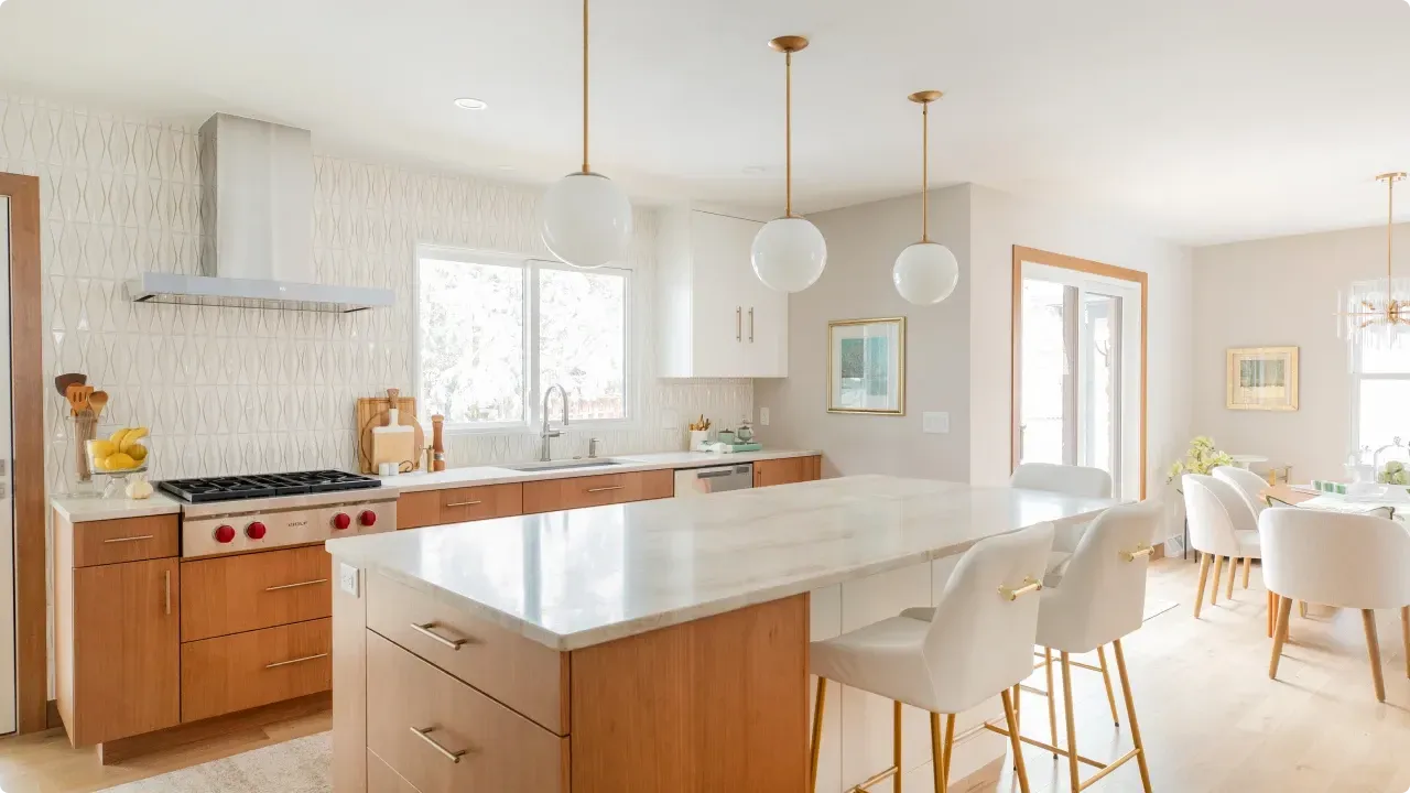 A kitchen with a large island in the middle of the room.