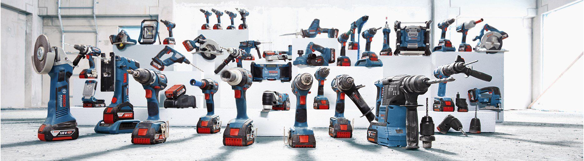 A bunch of tools are lined up in a room.