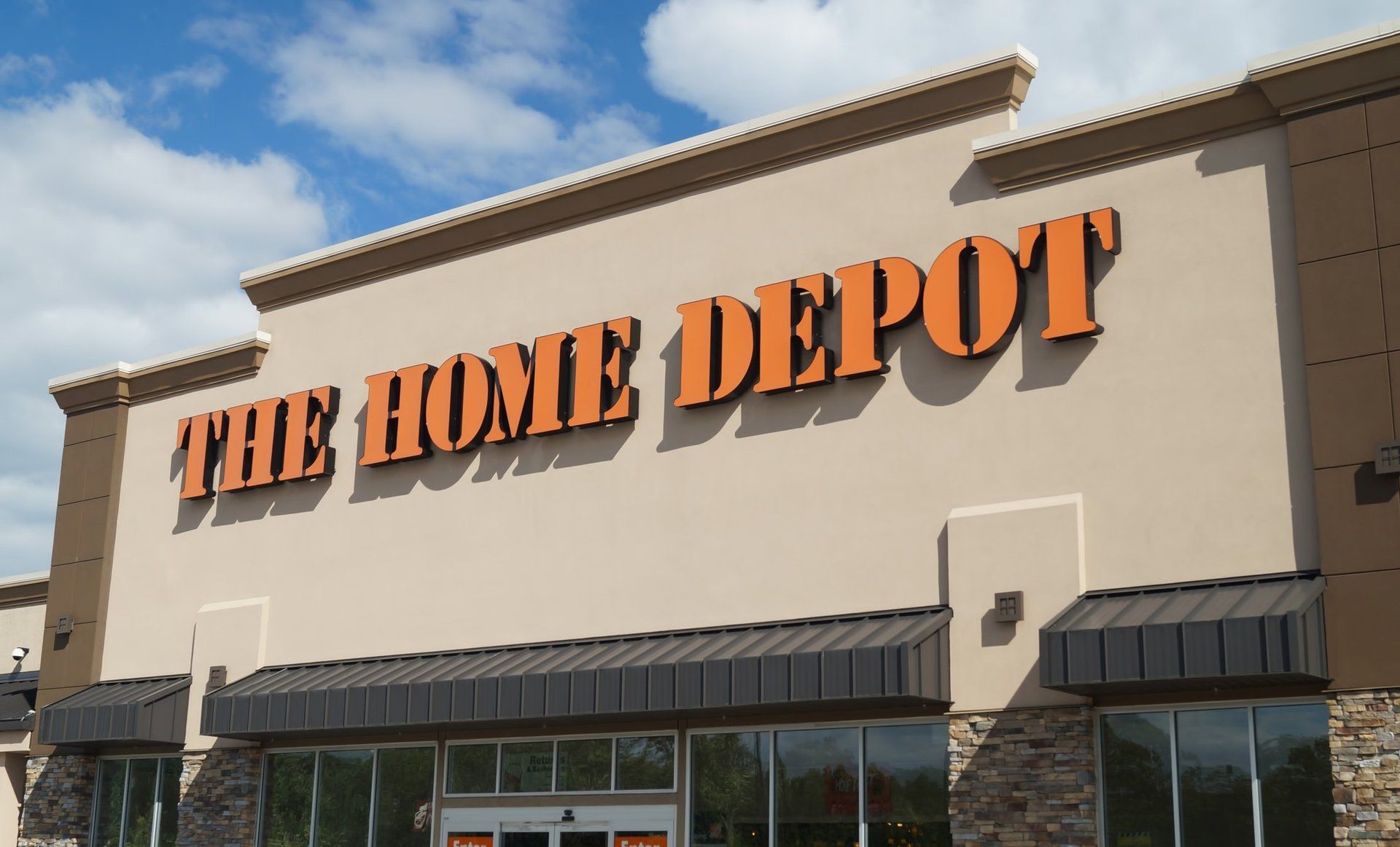 A home depot store with a blue sky in the background