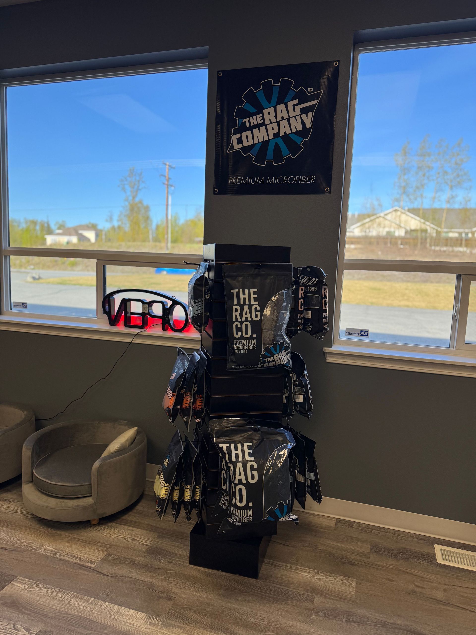 A room with a dog bed and a sign on the wall.