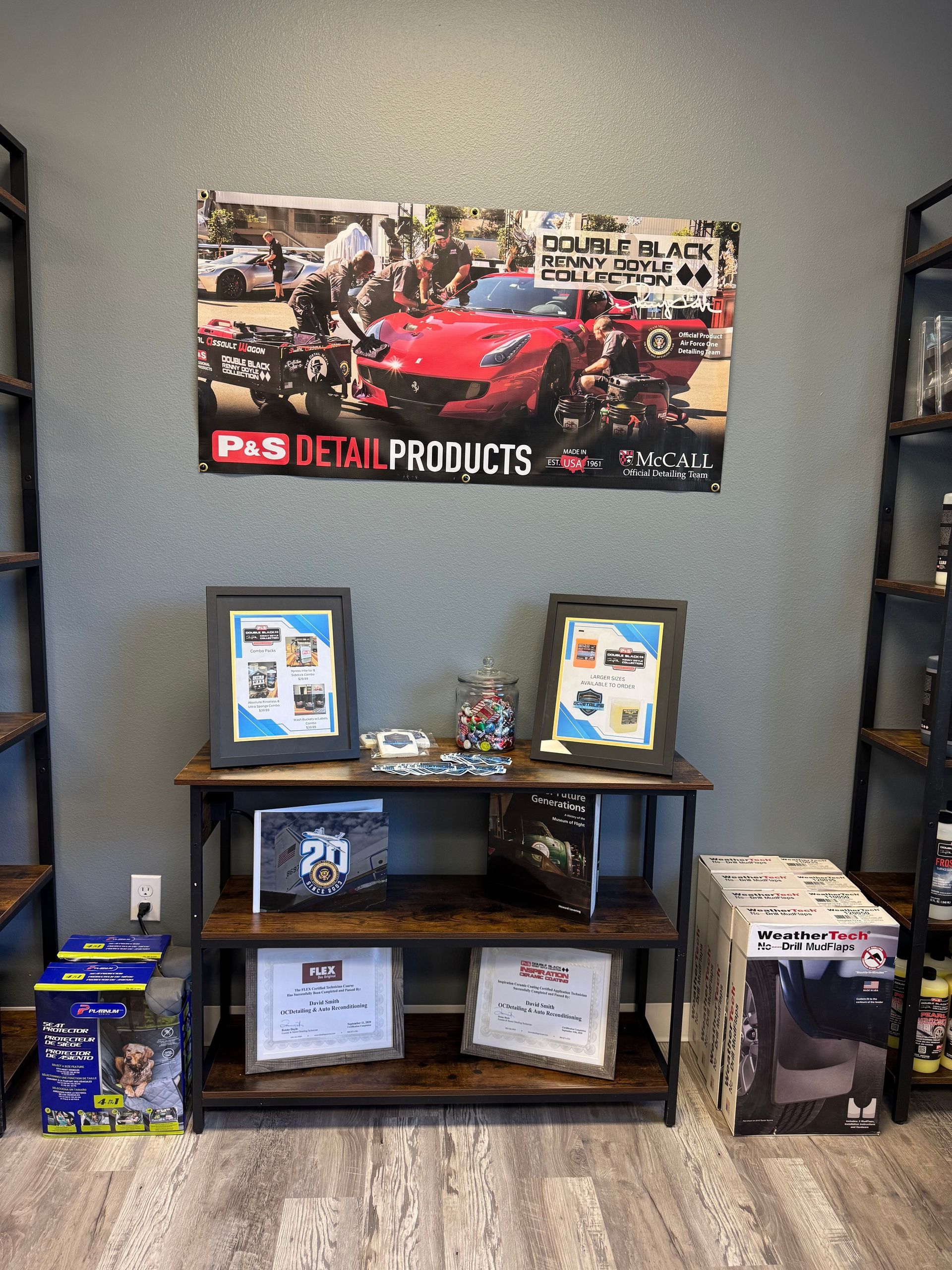 A room with a sign on the wall that says p & s detail products