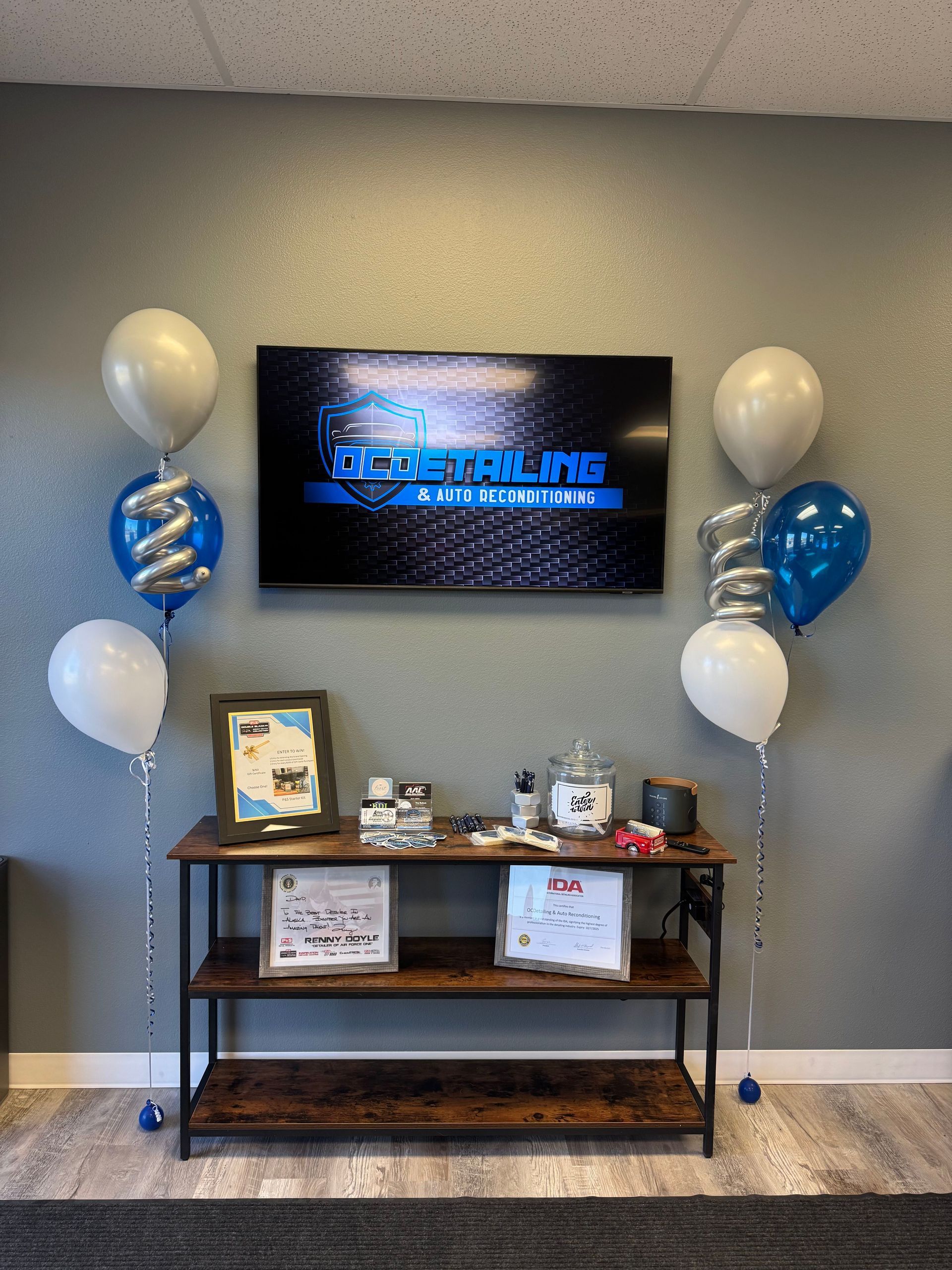 A room with balloons and a flat screen tv
