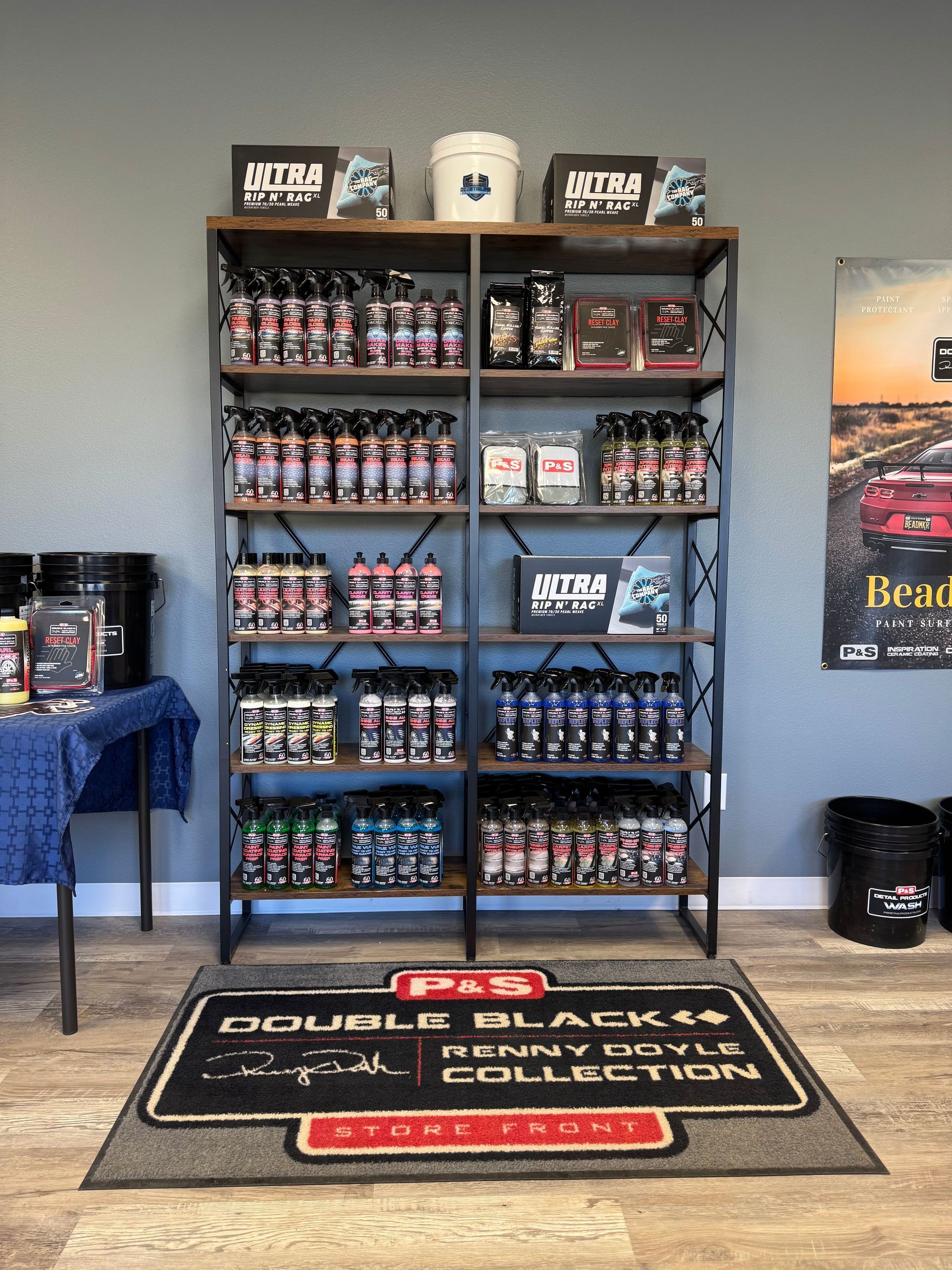 A room with a shelf filled with bottles of cleaning products and a rug.