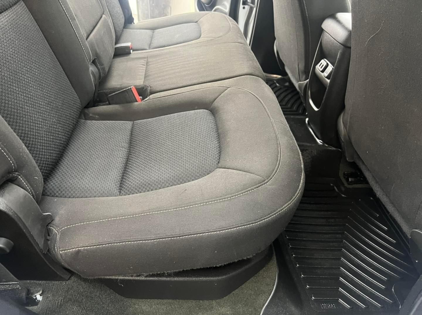 A close up of the back seat of a car.