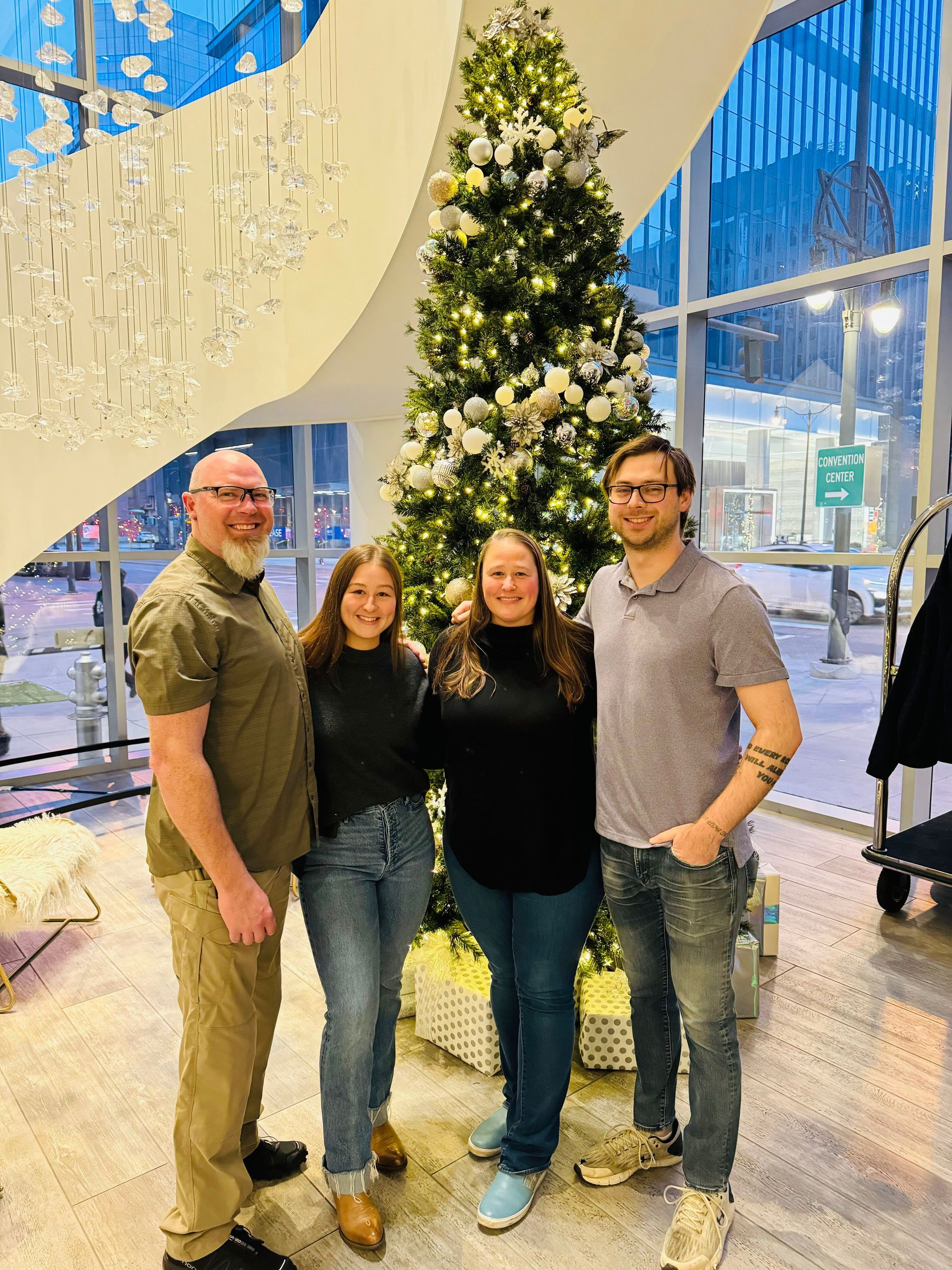 A man is working on the side of an airplane that says obama on it