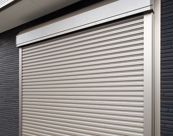 a close up of a garage door on a building .