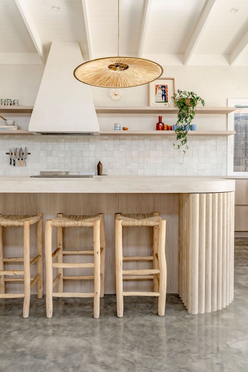 Kitchen With Light Wood Island and Stools, White Range Hood — Goode By Design in Unanderra, NSW