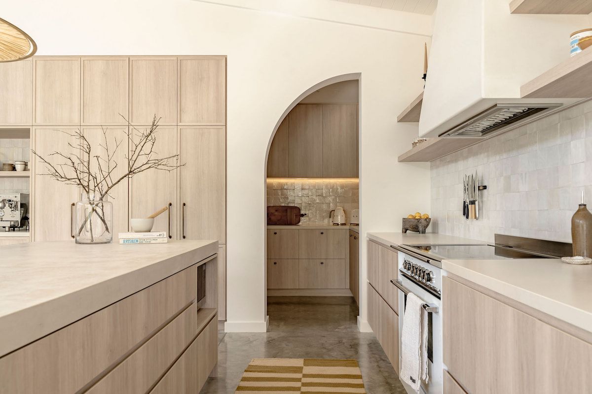 Modern Kitchen With Light Wood Cabinets — Goode By Design in Unanderra, NSW