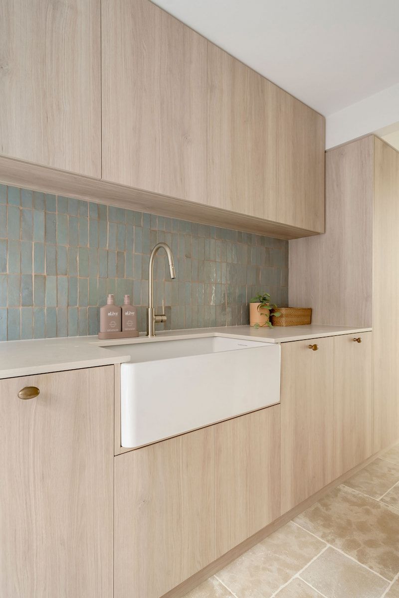 Light Wood Cabinets and Sink in a Kitchen — Goode By Design in Unanderra, NSW