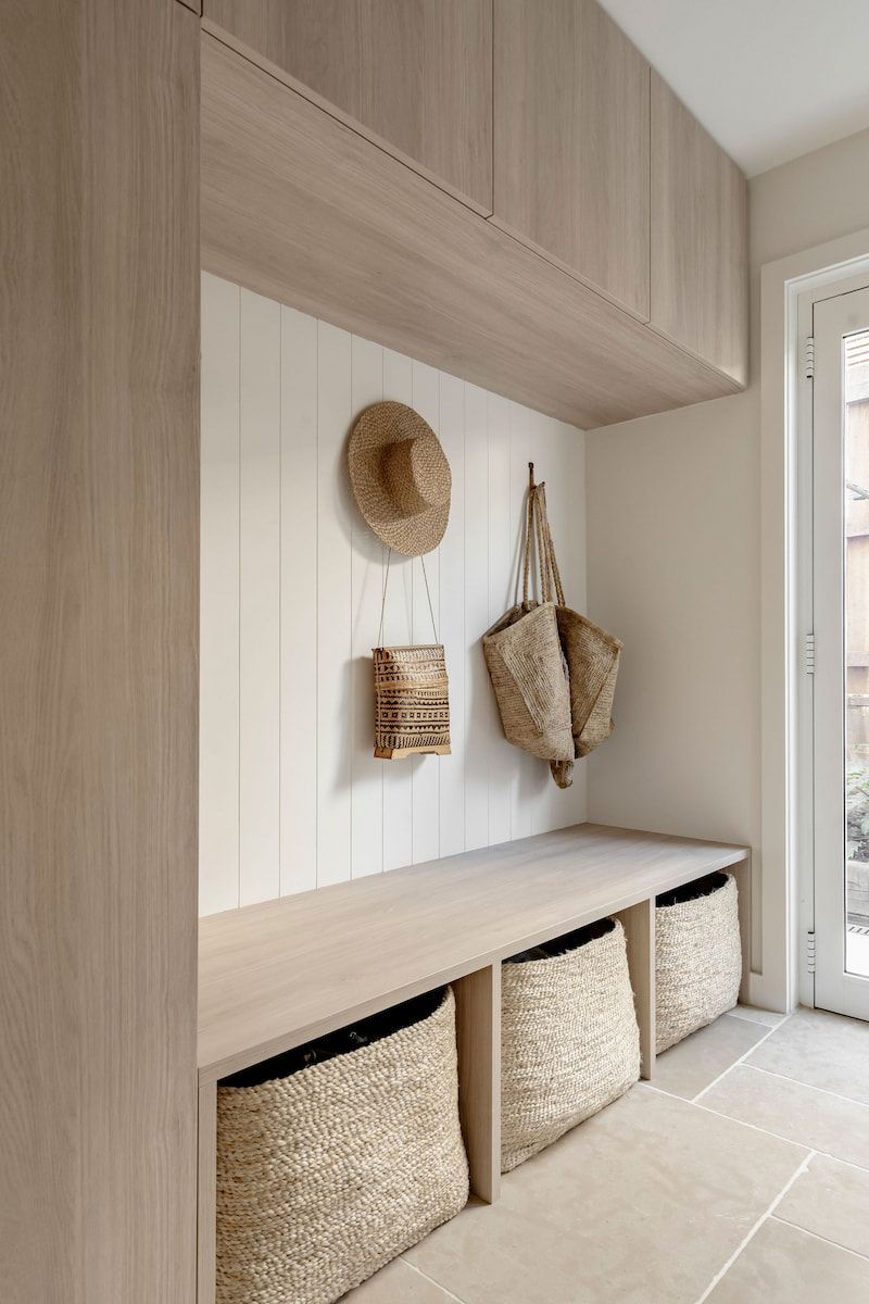 Mudroom With Wooden Cabinetry, Bench, and Woven Baskets — Goode By Design in Unanderra, NSW