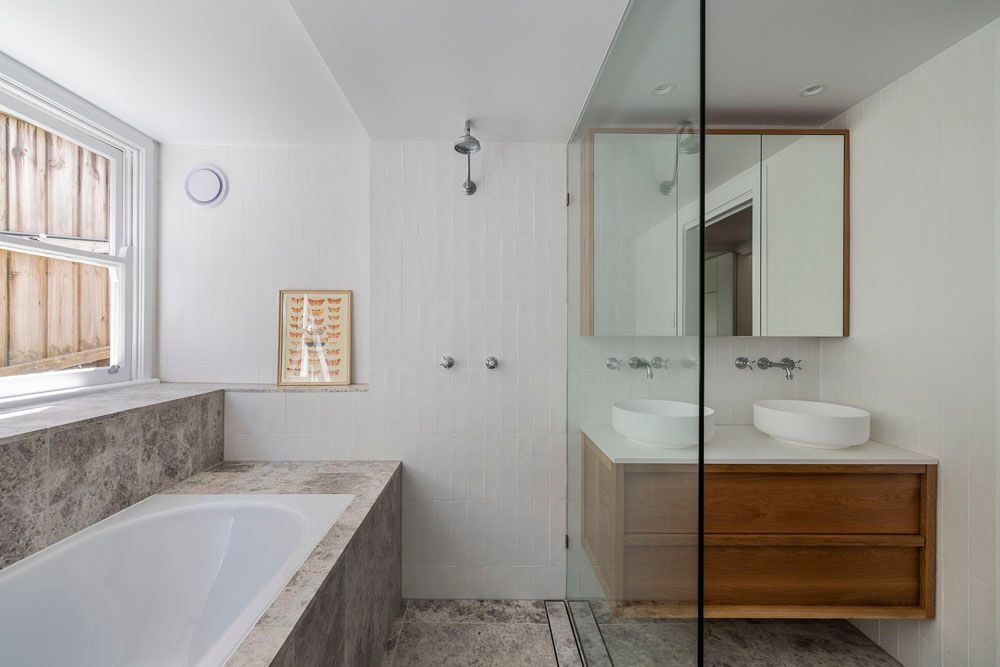 A bathroom with a bathtub, shower and vanity — Goode By Design in Southern Highlands, NSW