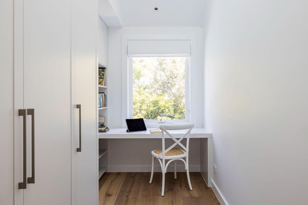 A Small Room with A Desk and Chair and A Window — Goode By Design in Unanderra, NSW