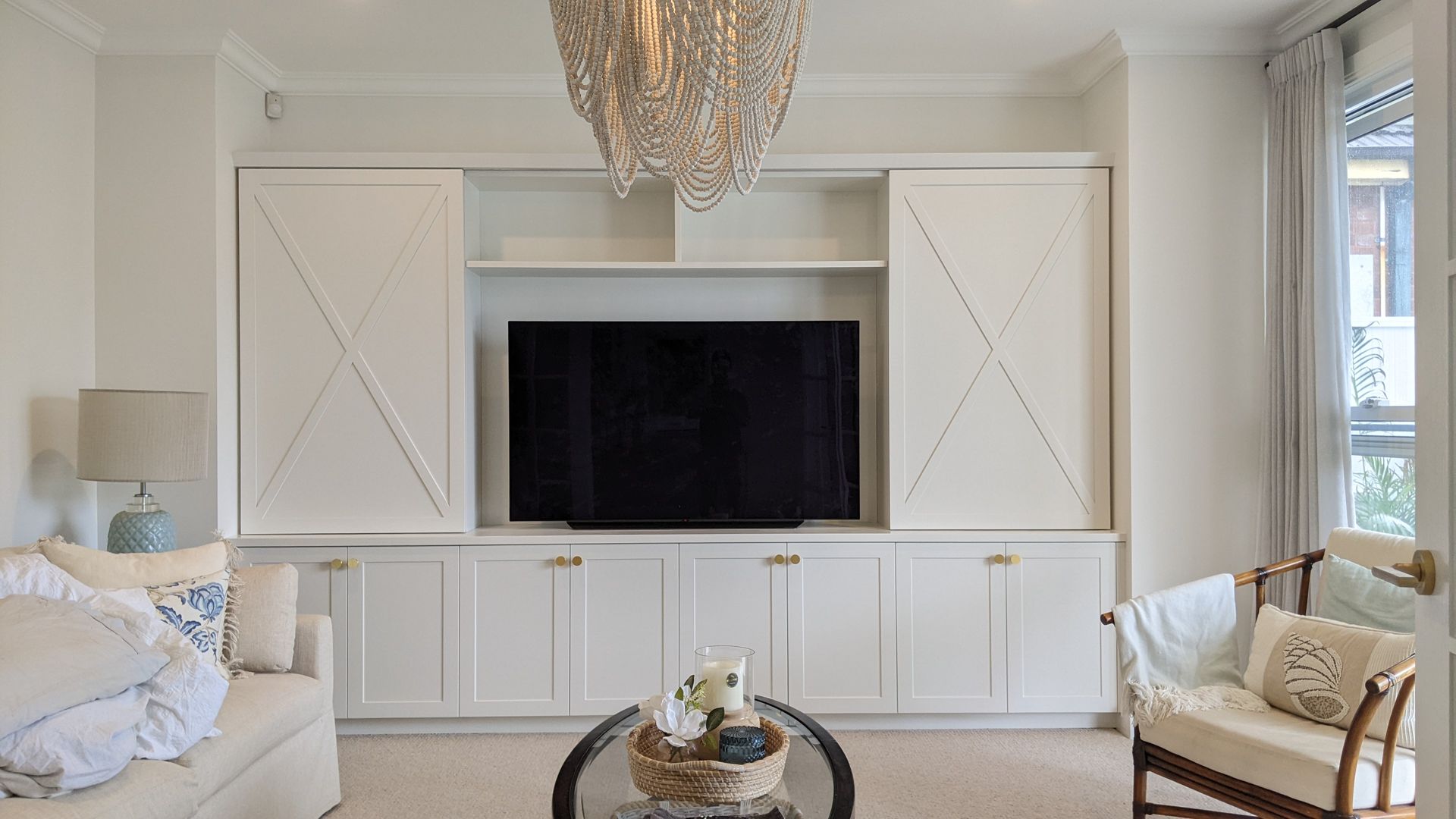 A Large TV Cabinet With A Tv On the wall— Goode By Design in Unanderra, NSW