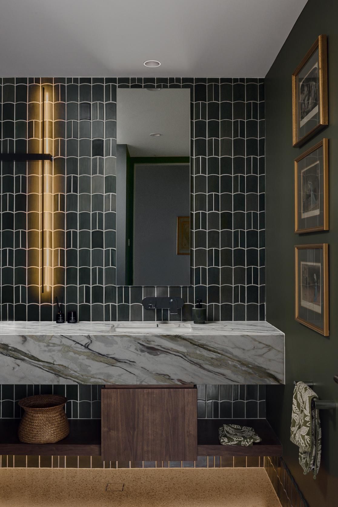 A Bathroom with Black Tiles and A Marble Sink — Goode By Design in Unanderra, NSW