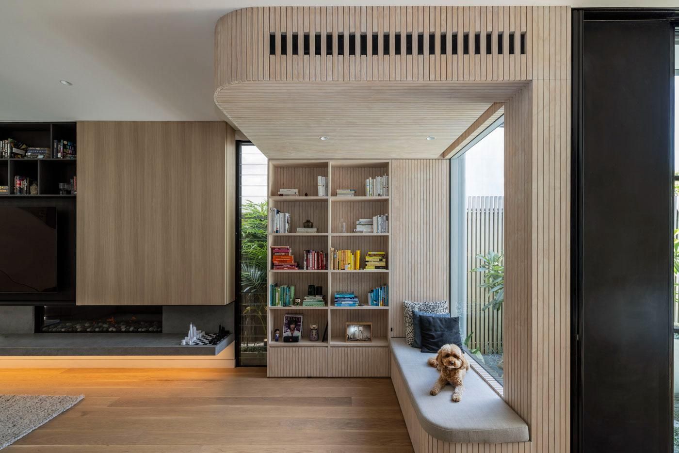 A Dog Is Sitting on A Bench in A Living Room Next to A Window — Goode By Design in Unanderra, NSW