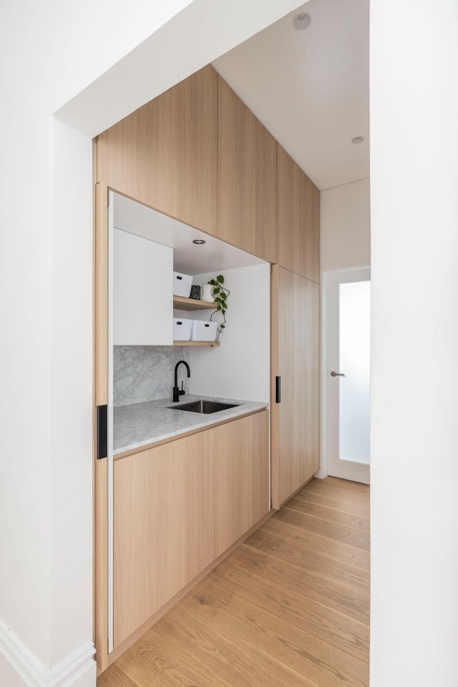 A Kitchen with Wooden Cabinets and A Sink — Goode By Design in Unanderra, NSW