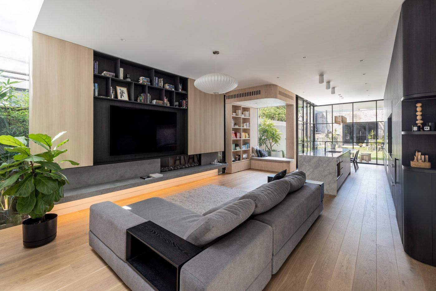 A Living Room with A Large Couch and A Flat Screen TV — Goode By Design in Unanderra, NSW