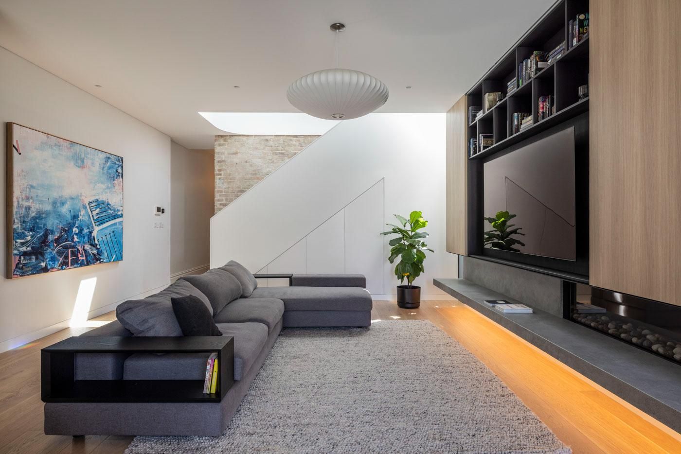 A Living Room with A Couch and A Flat Screen TV — Goode By Design in Unanderra, NSW