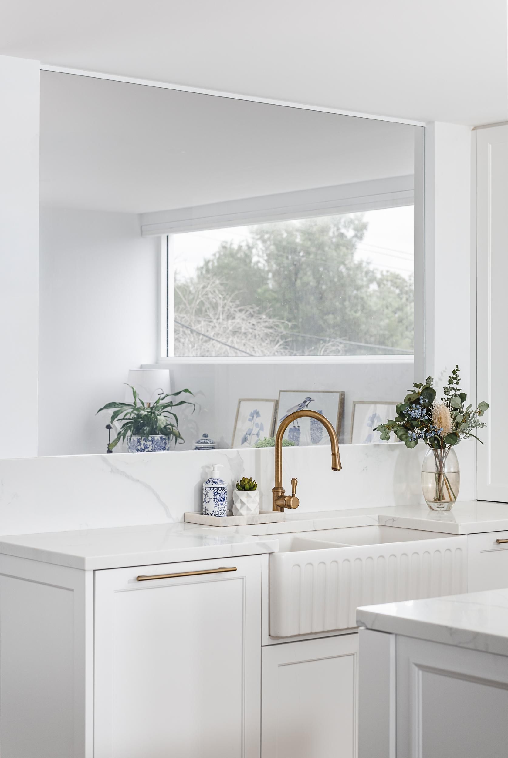 A Kitchen with A Sink, Dishwasher, and Large Mirror — Goode By Design in Unanderra, NSW