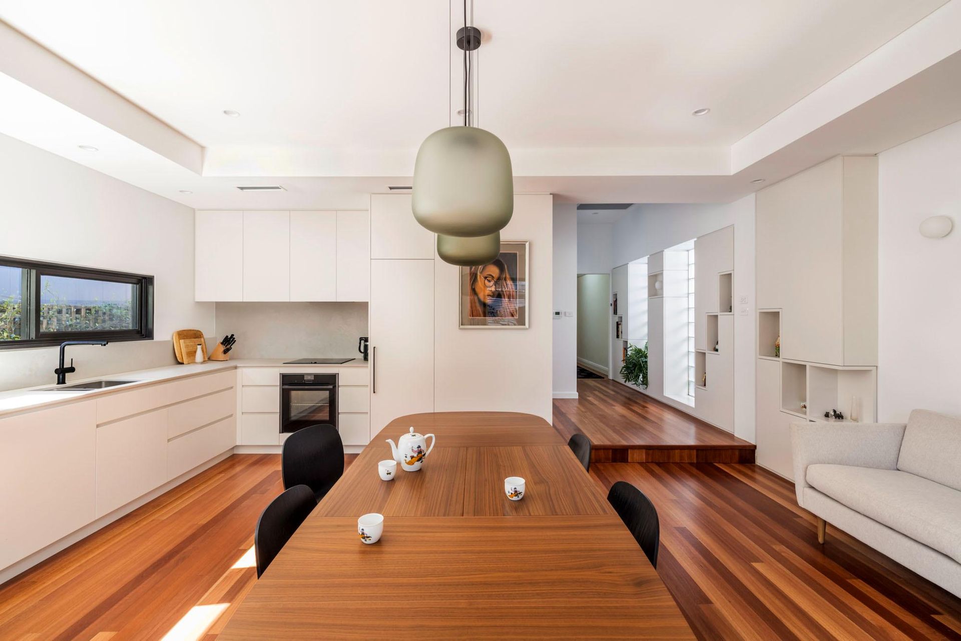 A Kitchen and Dining Room with A Wooden Table and Chairs — Goode By Design in Unanderra, NSW