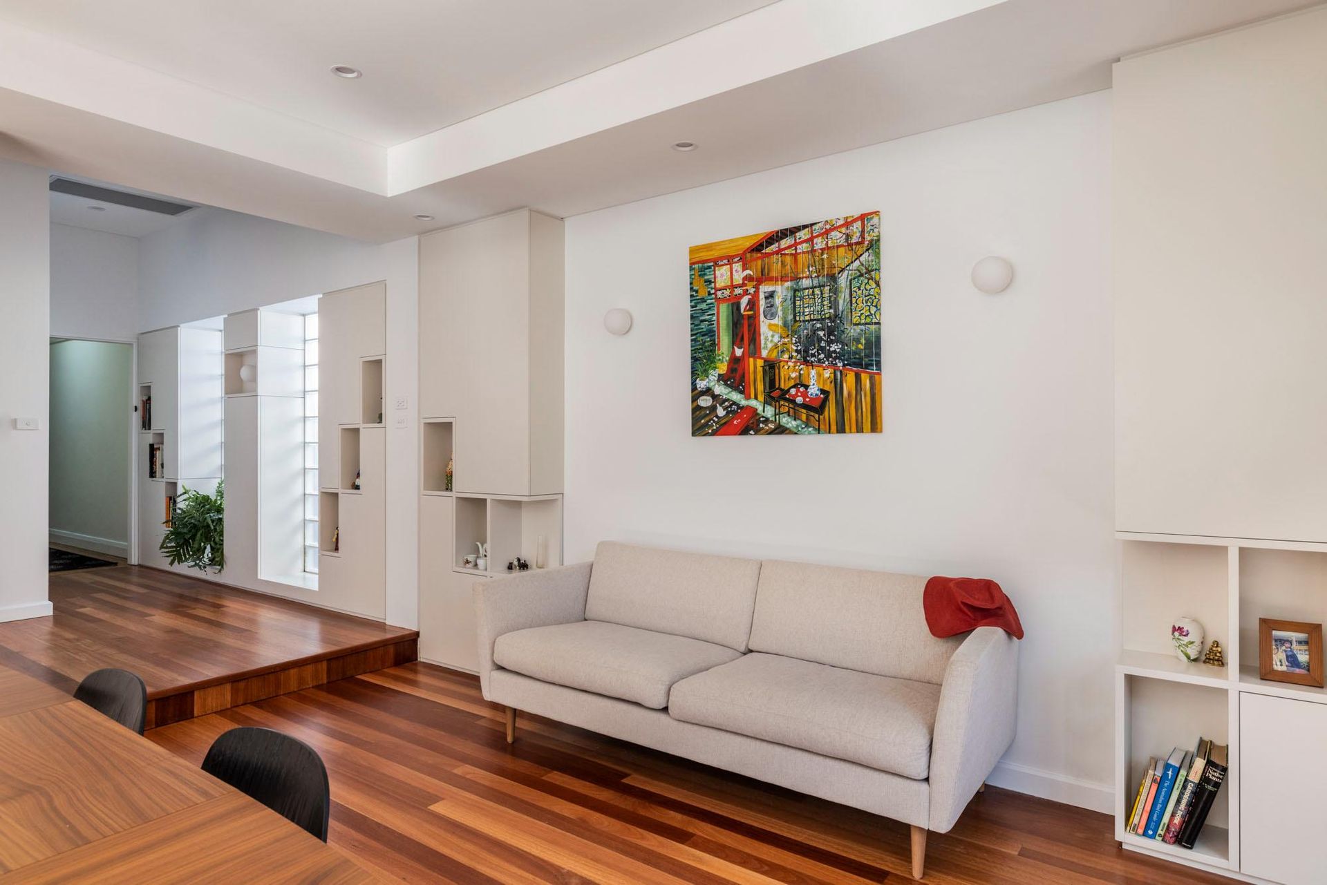 A Living Room with A Couch and A Painting on The Wall — Goode By Design in Unanderra, NSW