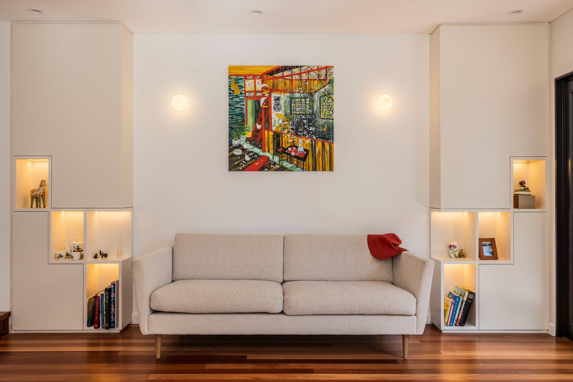 A Living Room with A Couch and A Painting on The Wall — Goode By Design in Unanderra, NSW