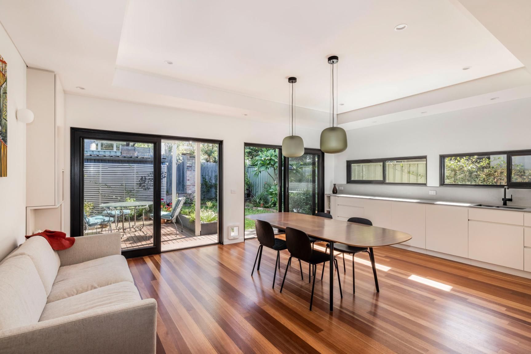 A Living Room with A Couch, Table and Chairs — Goode By Design in Unanderra, NSW