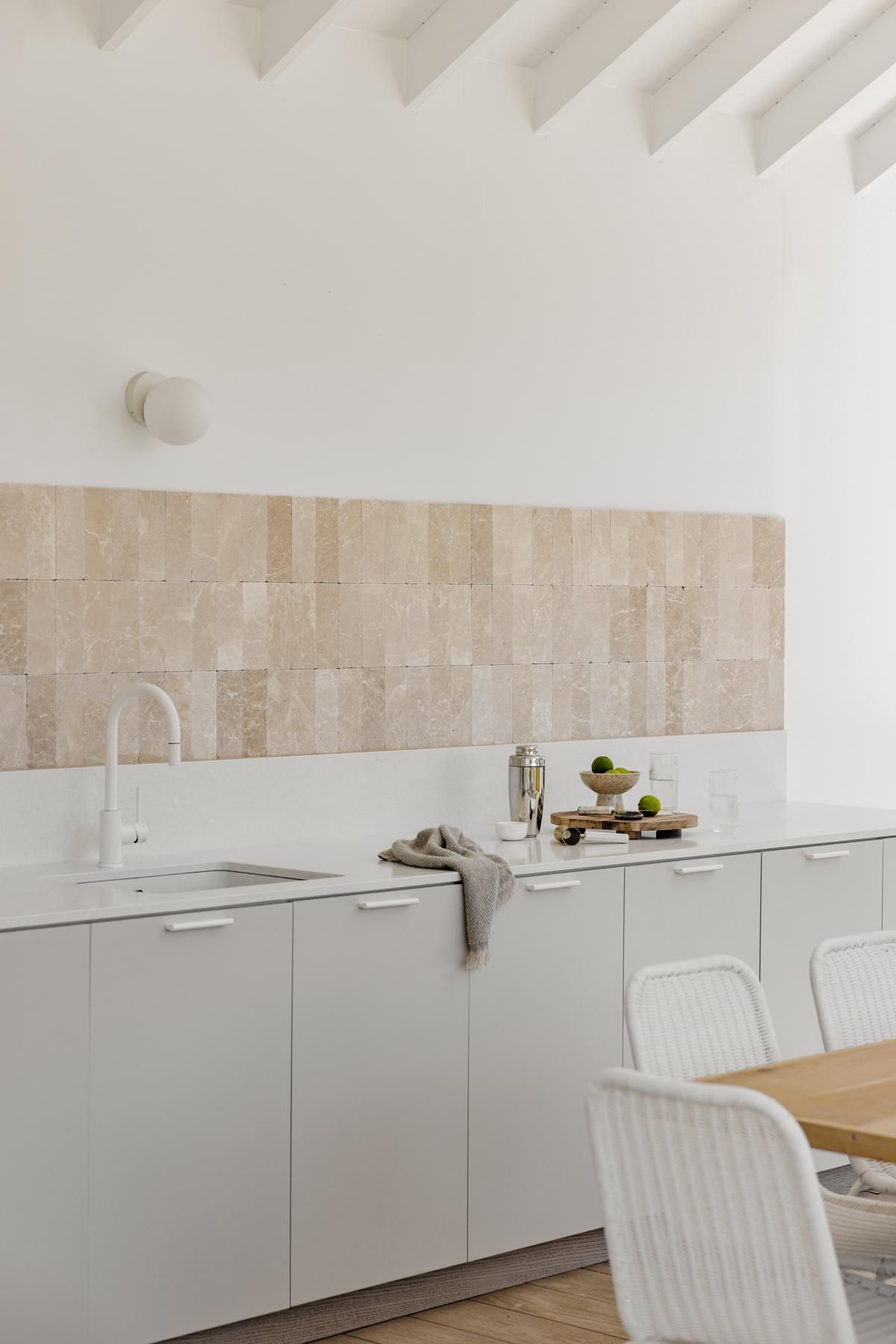 A Kitchen with White Cabinets, a Sink,  a Table and Chairs — Goode By Design in Unanderra, NSW
