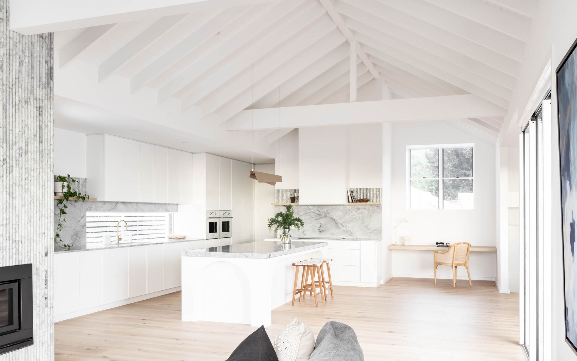A Living Room Filled with Furniture and A Kitchen with A Vaulted Ceiling — Goode By Design in Unanderra, NSW