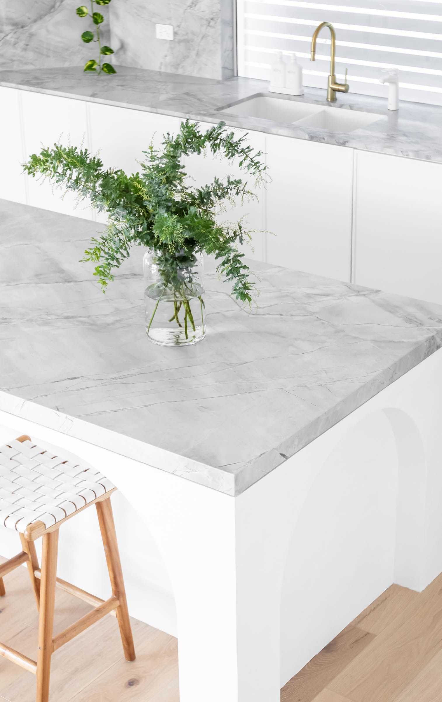 A Kitchen Counter with A Vase of Flowers on It — Goode By Design in Unanderra, NSW