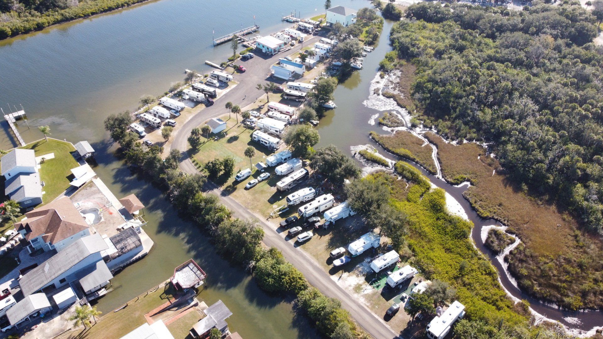 An aerial view of a marina with boats and trailers