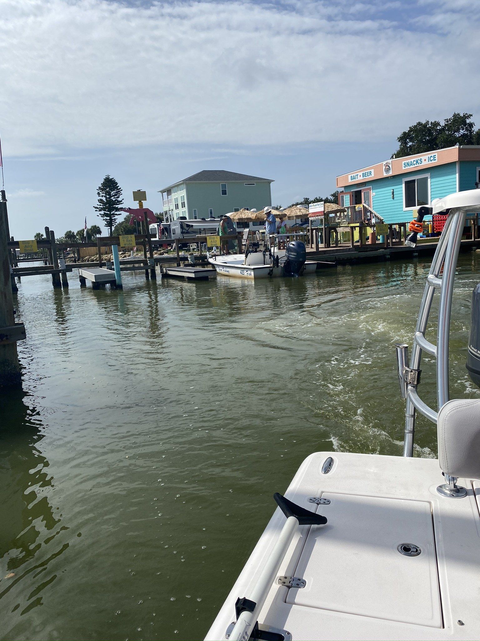 A boat is floating on top of a body of water.