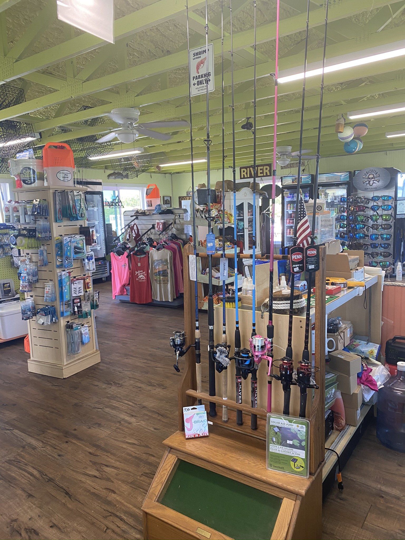 A fishing store filled with lots of fishing rods.