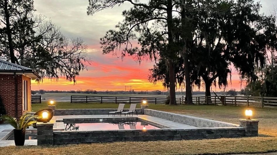 geometric pool at sunset with lighting
