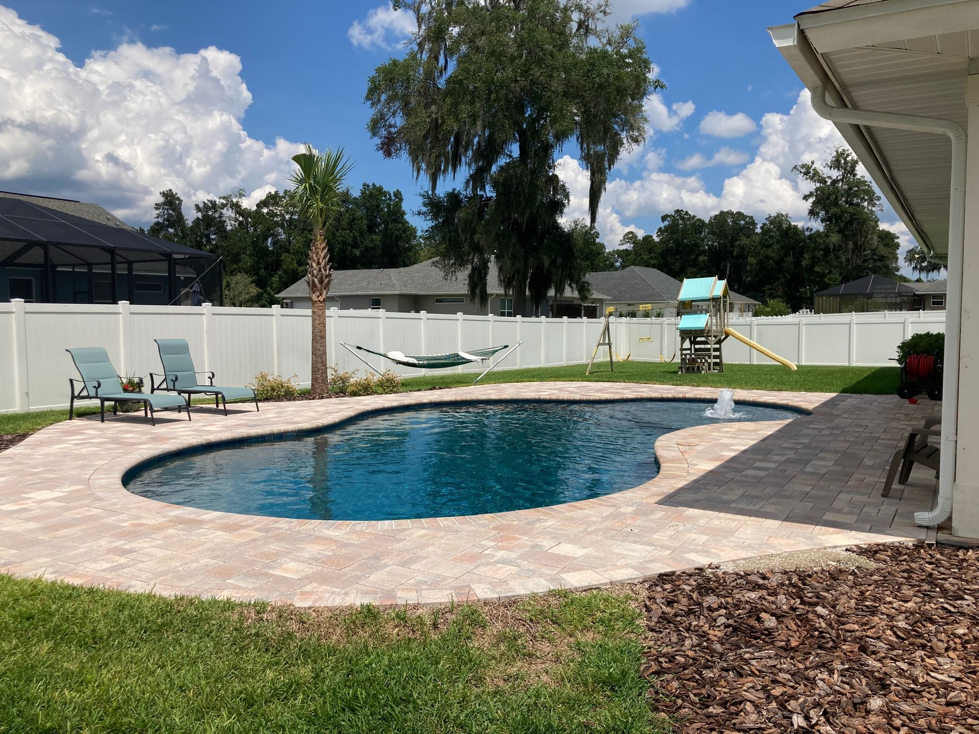 Freeform pool with paver deck