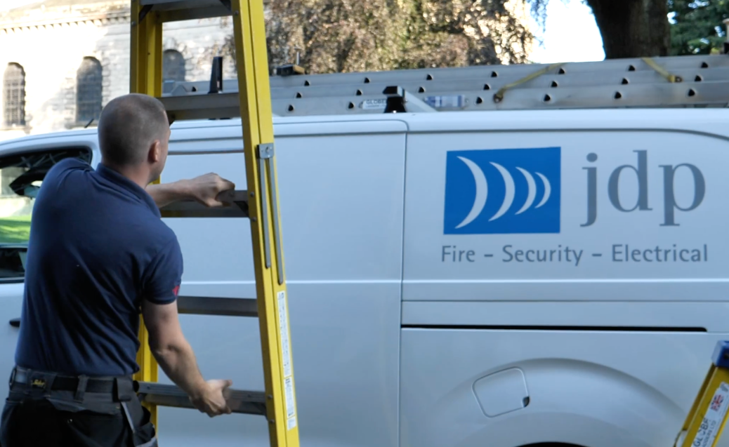 JDP conducting electrical maintenance check with van