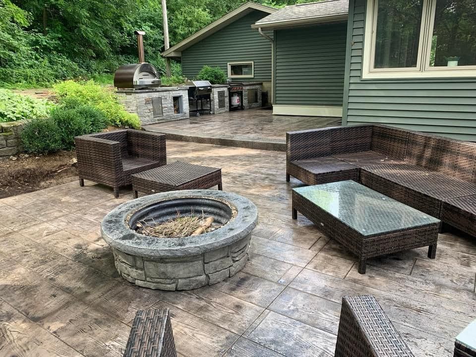 There is a fire pit in the middle of the patio.