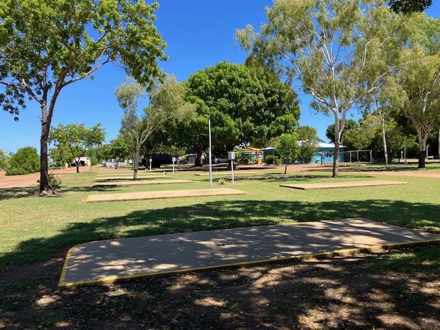 Park With Shaded Camping Pads, Trees, and Blue Sky — Karumba Point Holiday Tourist Park in Karumba, QLD