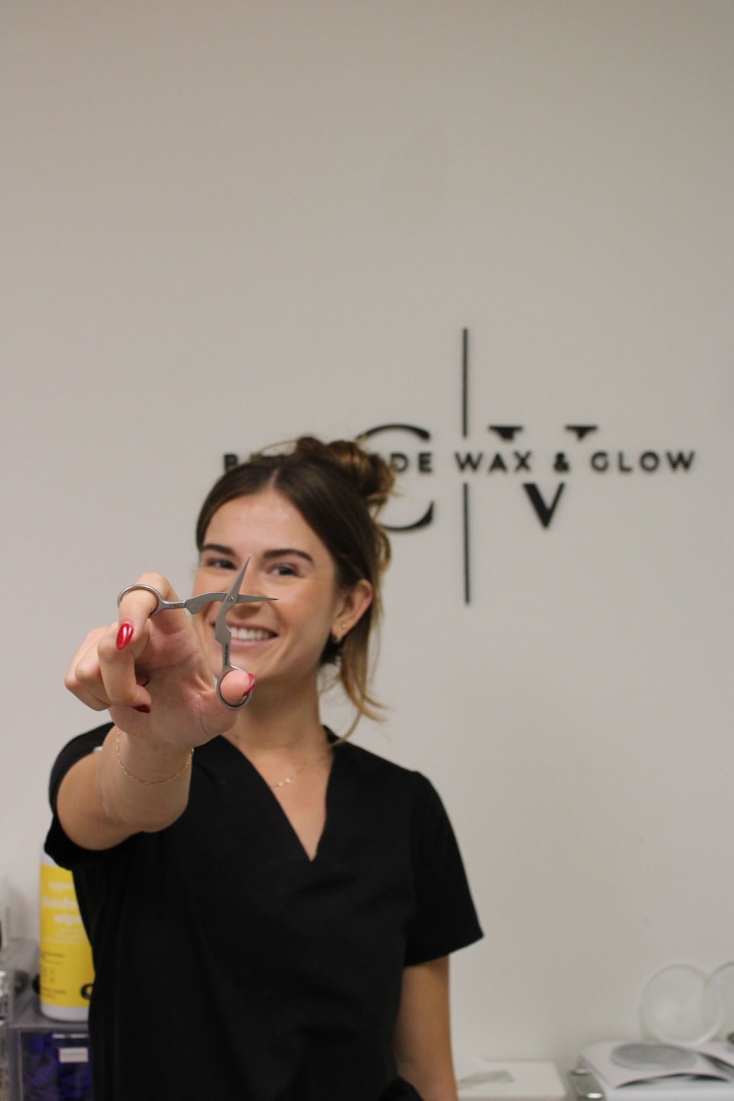 A desk with two chairs and a mirror on it in a room.