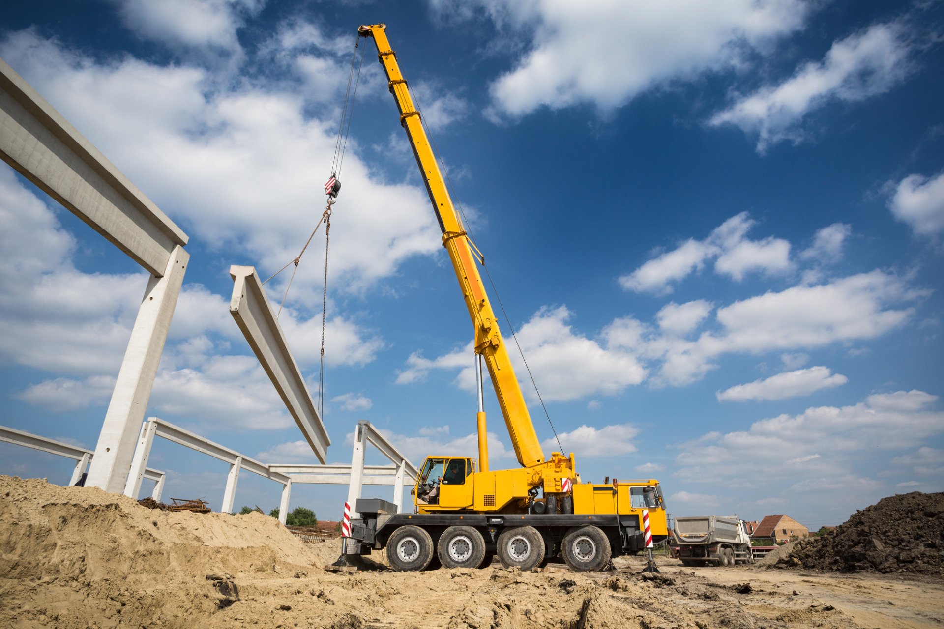 a yellow mobile crane in action