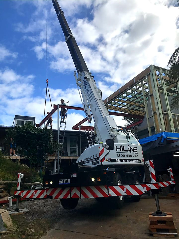 construction materials being lifted by a crane