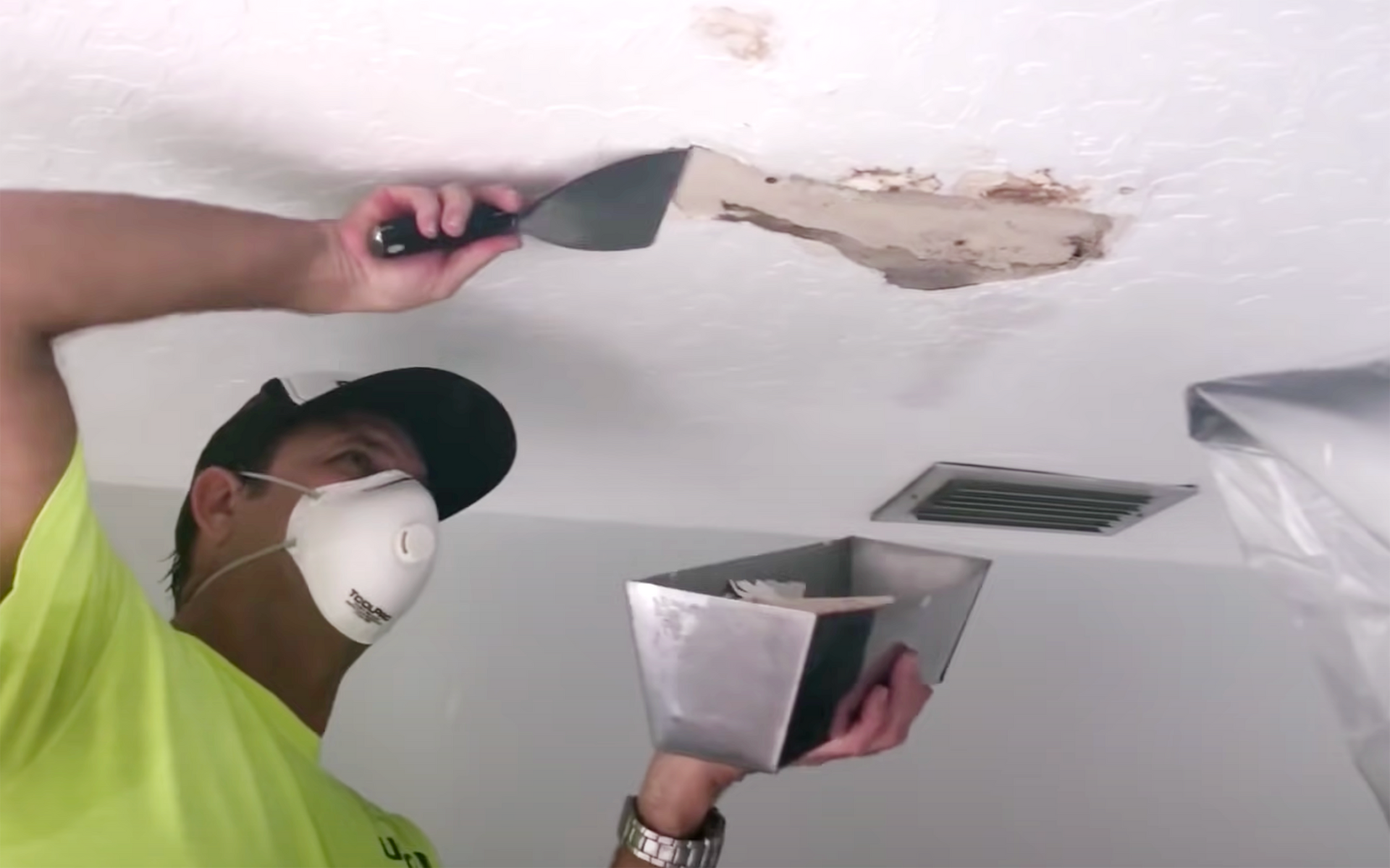 An image of drywall repair happening on a ceiling.