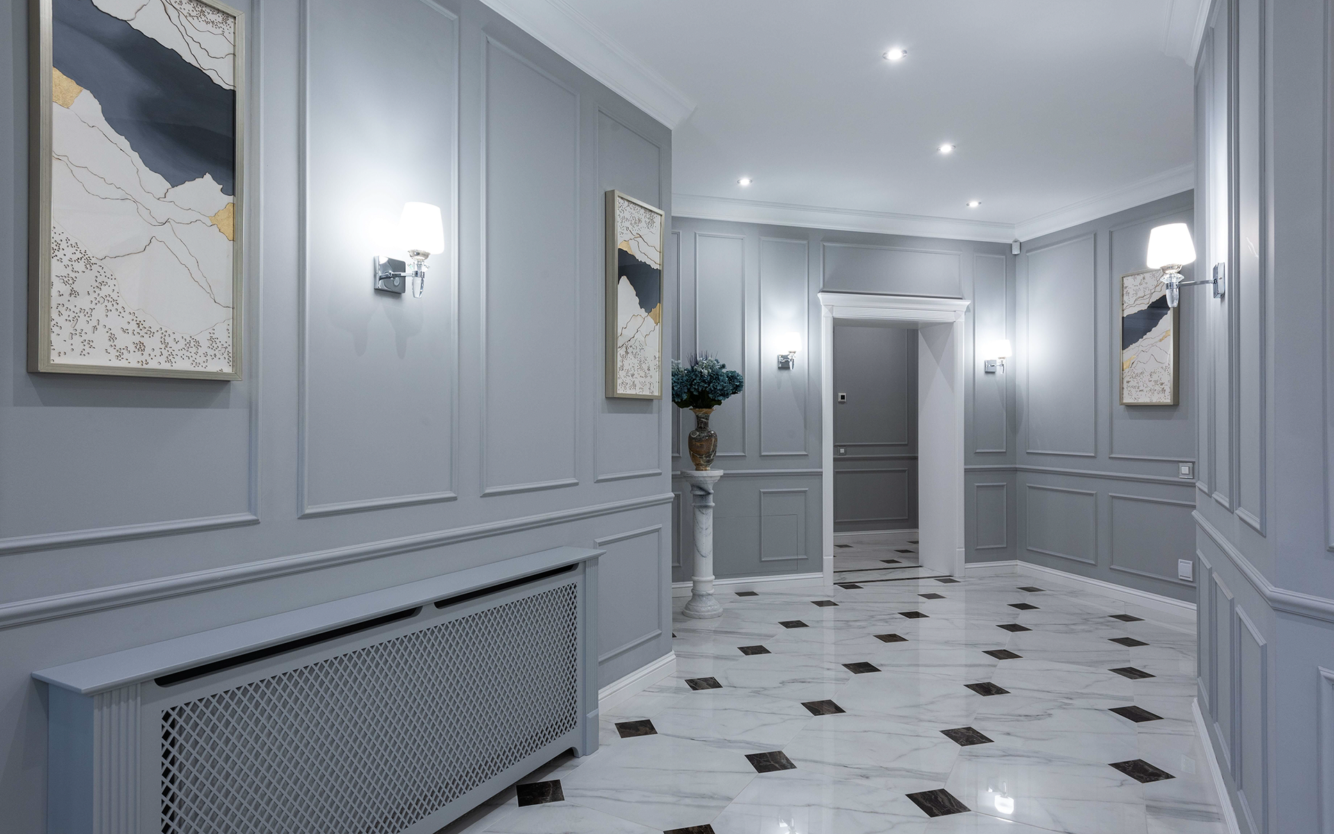 Beautifully painted hallway in gray with white trim with a marble checkered floor.