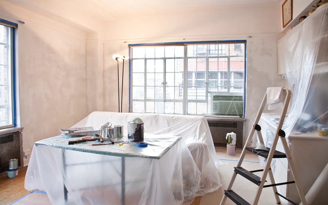 Interior room prepped for professional painting.