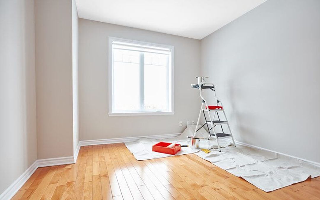 Room with ladder in the midst of being painted