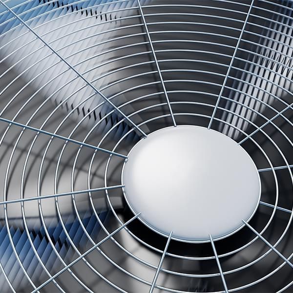A close up of a fan with a white circle in the middle